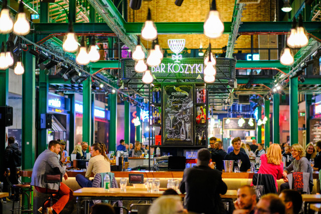 indoor bar with lights hanging from ceiling