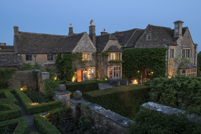 external view of whatley manor at dusk