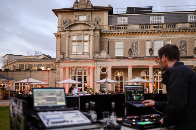 DJ playing on the lawn of stately home