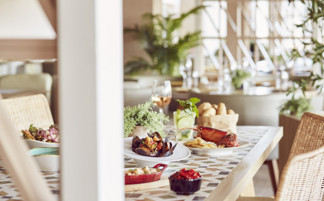 hotel dining table with an array of dishes such as mussels